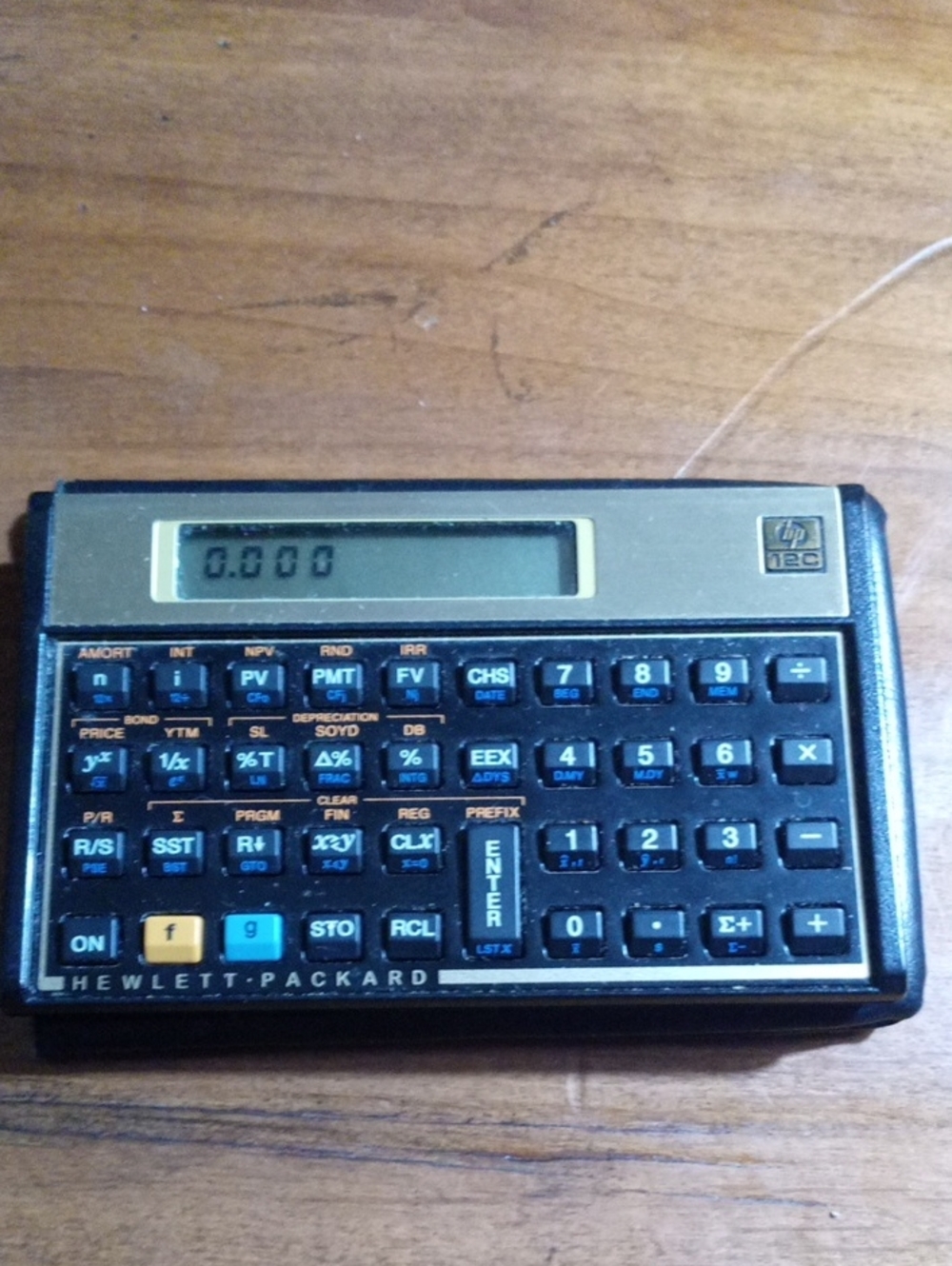 HP 12C Financial Calculator in Black and Gold Trim